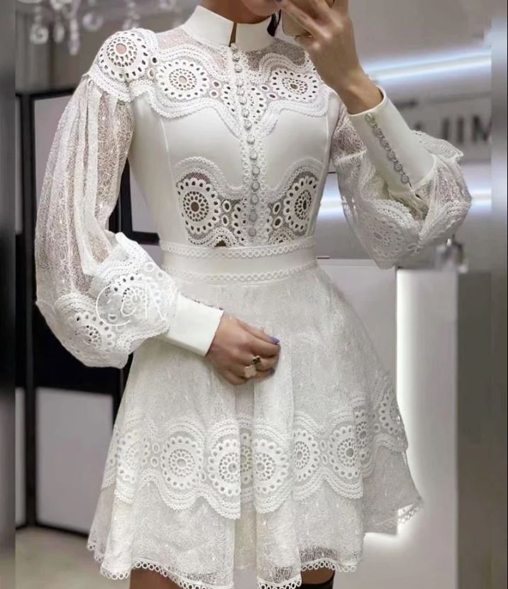 white mini dress with long sleeves